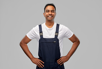 Image showing happy smiling indian worker or builder