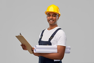 Image showing happy indian builder with blueprint and clipboard