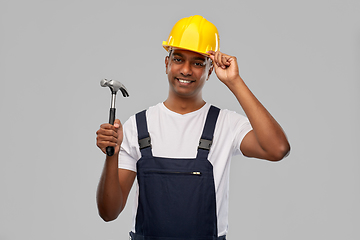 Image showing happy smiling indian worker or builder with hammer