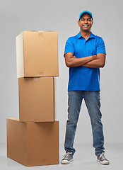 Image showing happy indian delivery man with parcel boxes