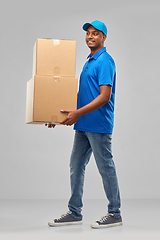 Image showing happy indian delivery man with parcel boxes