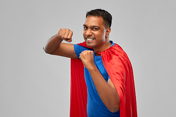 Image showing indian man in superhero cape makes winning gesture