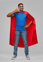 Image showing indian man in superhero cape making call gesture