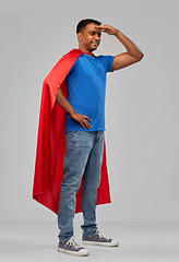 Image showing indian man in red superhero cape looking far away