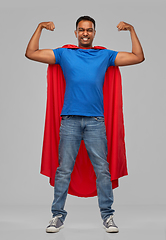 Image showing indian man in superhero cape showing his power