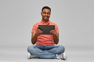 Image showing happy indian man with tablet pc