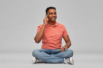 Image showing happy indian man calling on smartphone