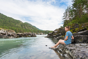 Image showing Woman resting at river