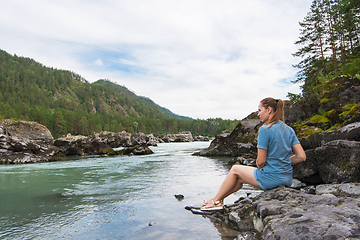 Image showing Woman resting at river