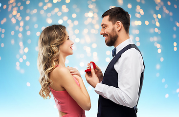 Image showing man giving woman engagement ring on valentines day