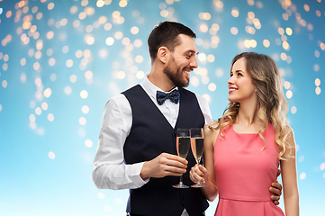 Image showing happy couple with champagne glasses toasting