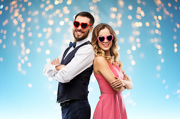 Image showing happy couple in heart-shaped sunglasses