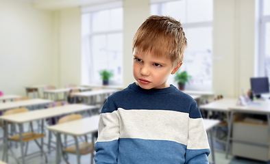 Image showing portrait of gloomy little boy at school