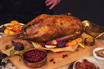 Image showing Roasted goose with herbs berries and vegetables