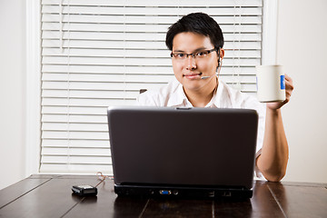 Image showing Working asian entrepreneur