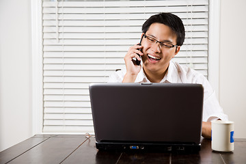 Image showing Asian entrepreneur on the phone