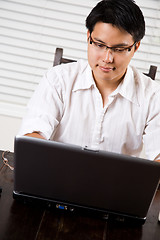 Image showing Working asian entrepreneur