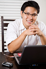 Image showing Working asian entrepreneur