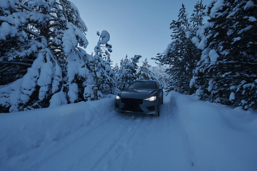 Image showing offroad suv car on icy winter north road