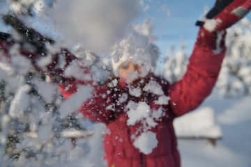 Image showing girl throwing fresh snow at beautiful sunny winter day