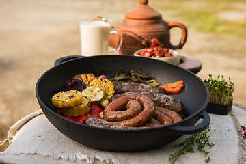 Image showing Grilled sausages with vegetables