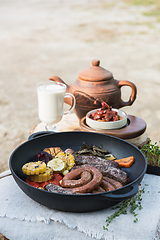 Image showing Grilled sausages with vegetables