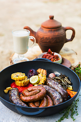 Image showing Grilled sausages with vegetables