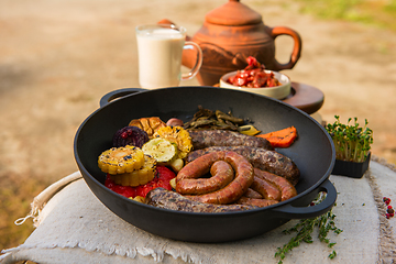 Image showing Grilled sausages with vegetables