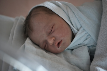 Image showing newborn baby sleeping in bed at hospital