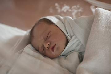 Image showing newborn baby sleeping in bed at hospital