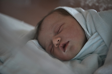 Image showing newborn baby sleeping in bed at hospital