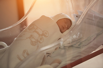 Image showing newborn baby sleeping in bed at hospital