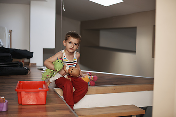 Image showing Little boy child playing with creative toys