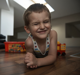 Image showing Little boy child playing with creative toys