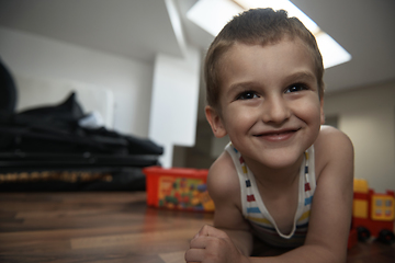 Image showing Little boy child playing with creative toys