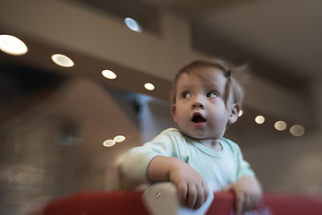 Image showing cute little baby playing in mobile bed