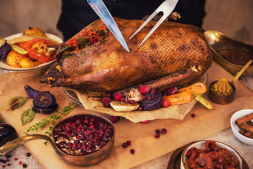 Image showing Roasted goose with herbs berries and vegetables