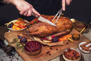 Image showing Roasted goose with herbs berries and vegetables