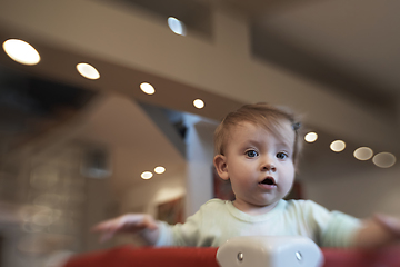 Image showing cute little baby playing in mobile bed