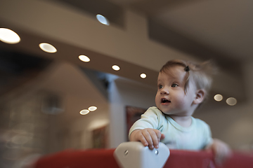 Image showing cute little baby playing in mobile bed