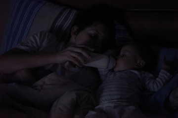 Image showing baby eating milk from bottle