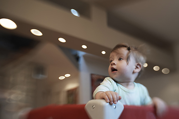 Image showing cute little baby playing in mobile bed