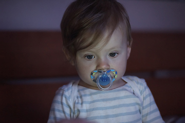 Image showing cute little baby playing and making first steps