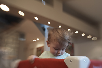 Image showing cute little baby playing in mobile bed