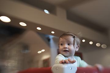 Image showing cute little baby playing in mobile bed