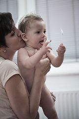 Image showing cute little baby girl taking a bath