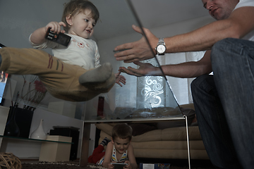 Image showing Little child playing with sister at home