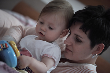 Image showing mother is playing with baby at home