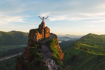 Image showing Man standing on top of cliff