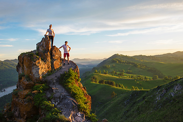 Image showing Happy man and woman on top mountain